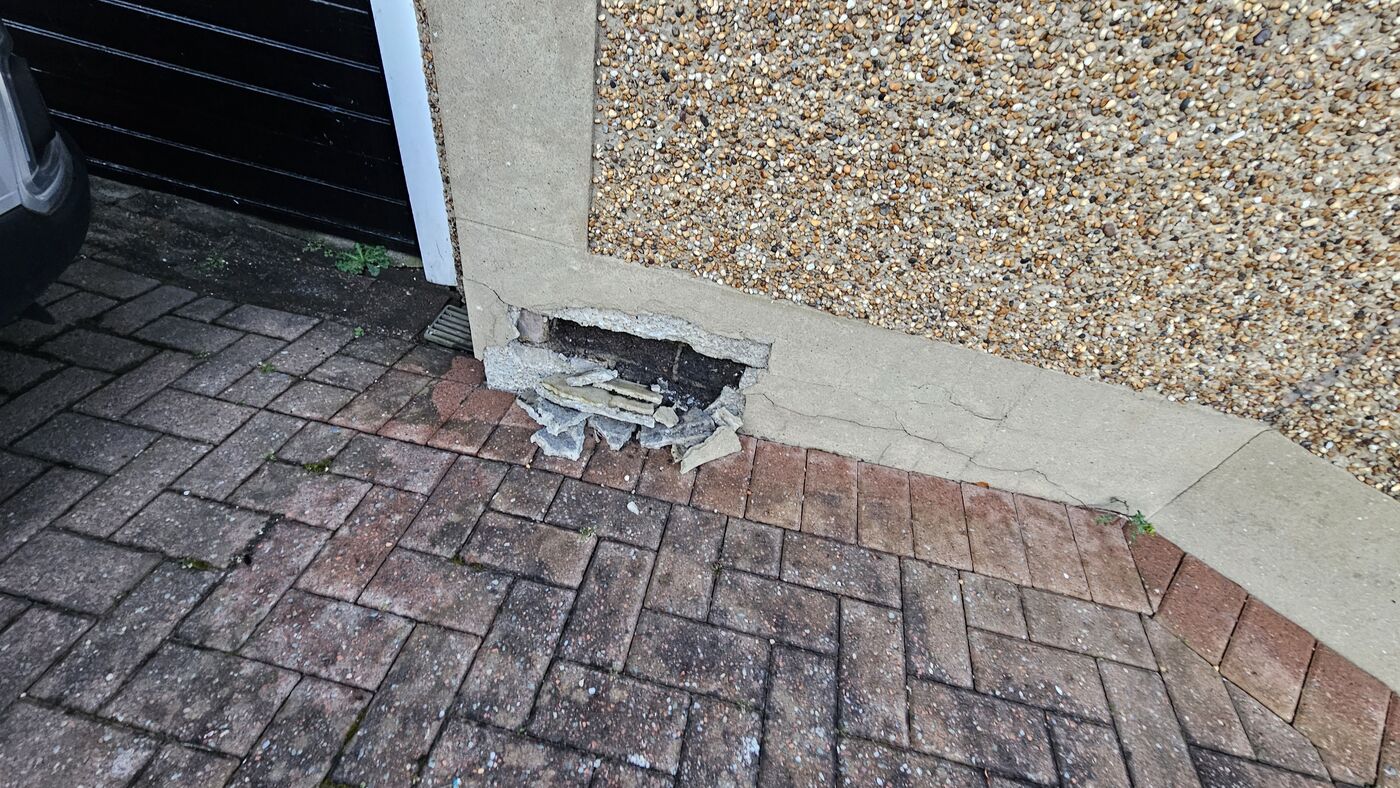 Plinth stripped back — full extent of damage revealed