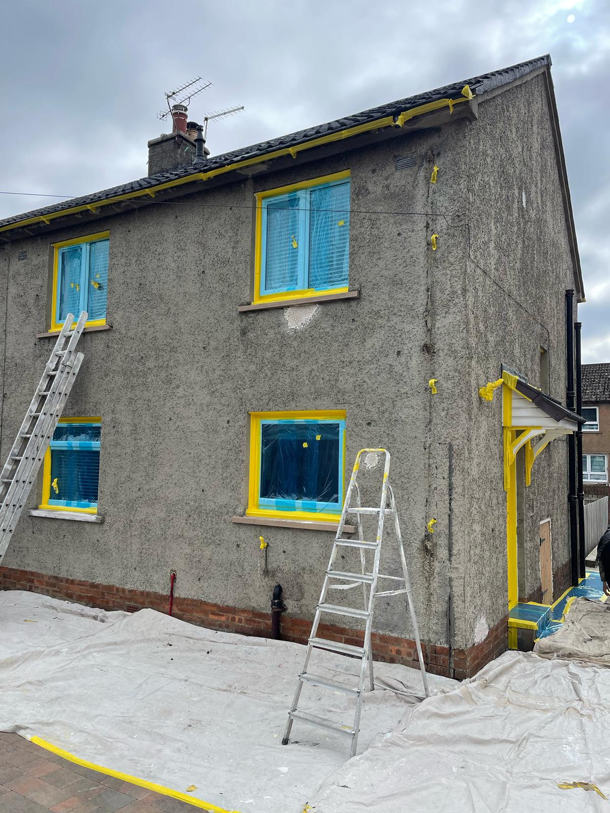 Windows, doors & paving masked before coating