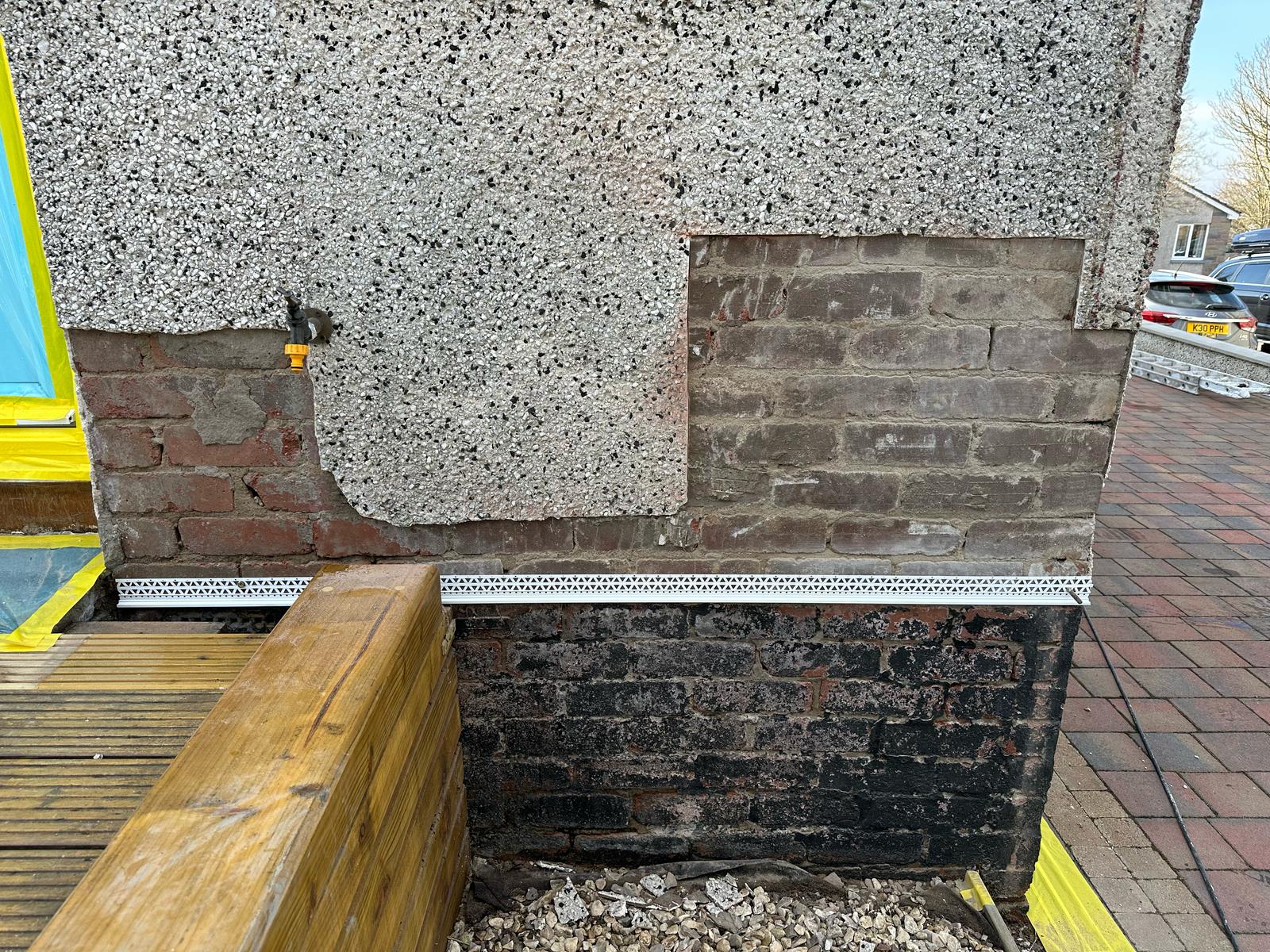 Blown render & exposed brick